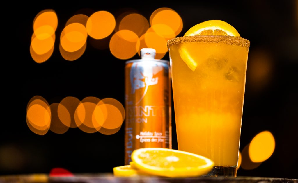 Mocktail garnished with orange and using Red Bull